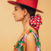 girl with red hearts oversize scrunchy and "baciami ancora" hat